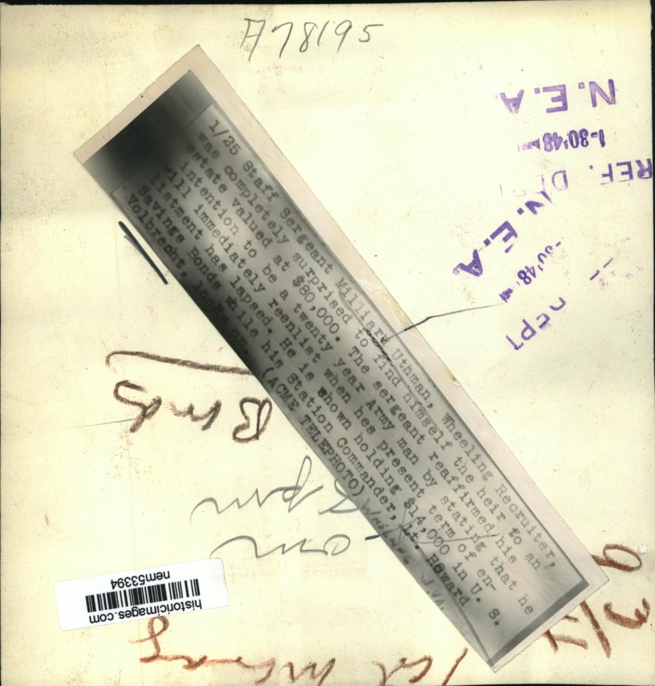 1948 Press Photo Staff Sergeant Milliard Uthman holds United States Savings Bond