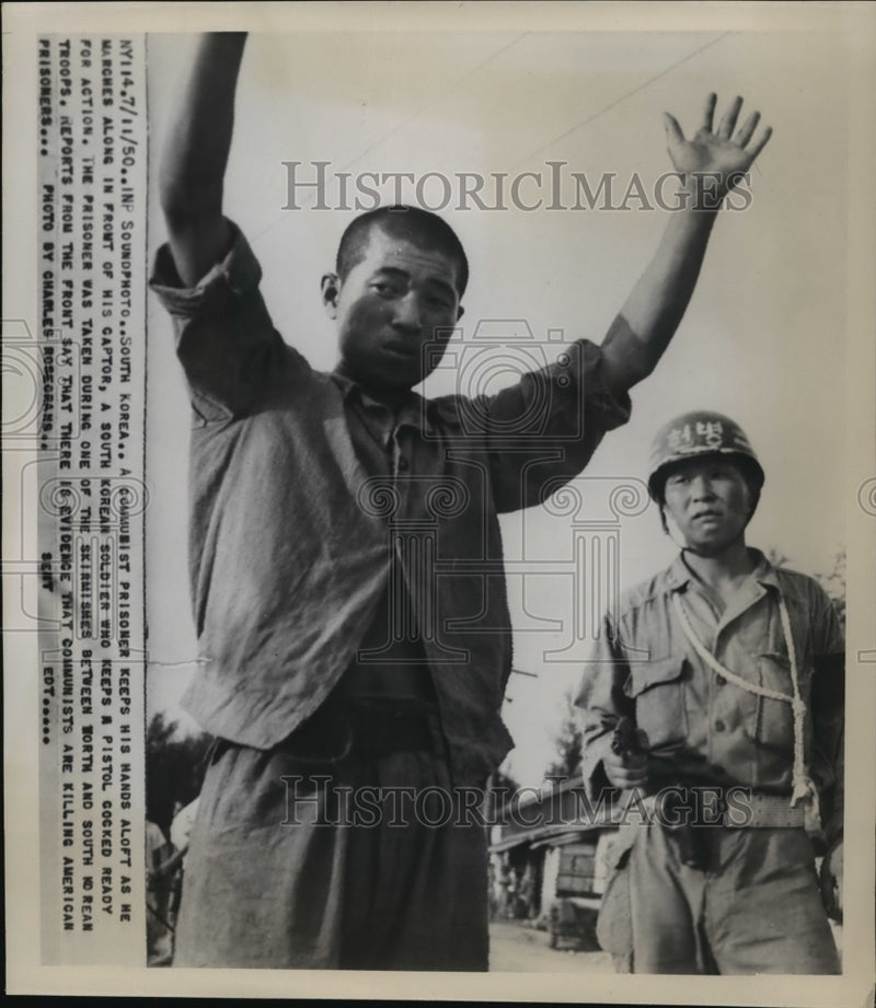 Load image into Gallery viewer, 1950 Press Photo A Communist prisoner guarded by a South Korean Soldier
