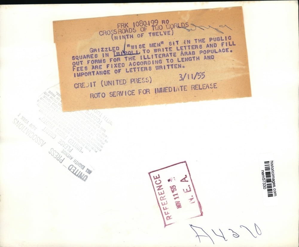 1955 Press Photo Men in Tripoli fill out form for Illiterate Arab Populace