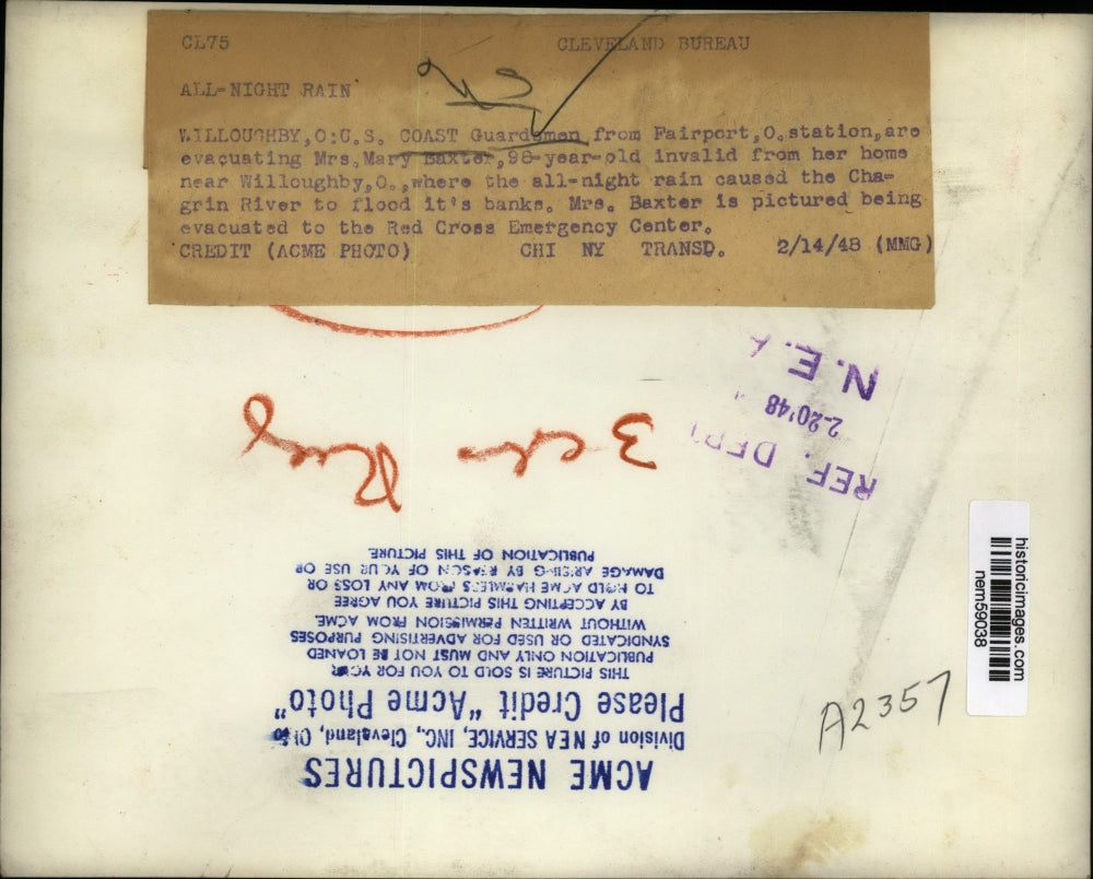 1948 Press Photo American Coast Guards rescue Mrs Mary Baxter from the flood