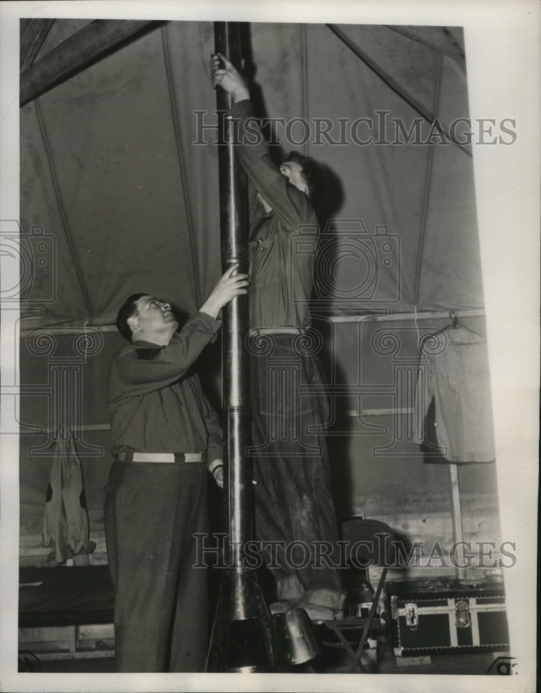 Load image into Gallery viewer, 1941 Press Photo Signal Corps men set up pipe for tent stove at Camp Blanding
