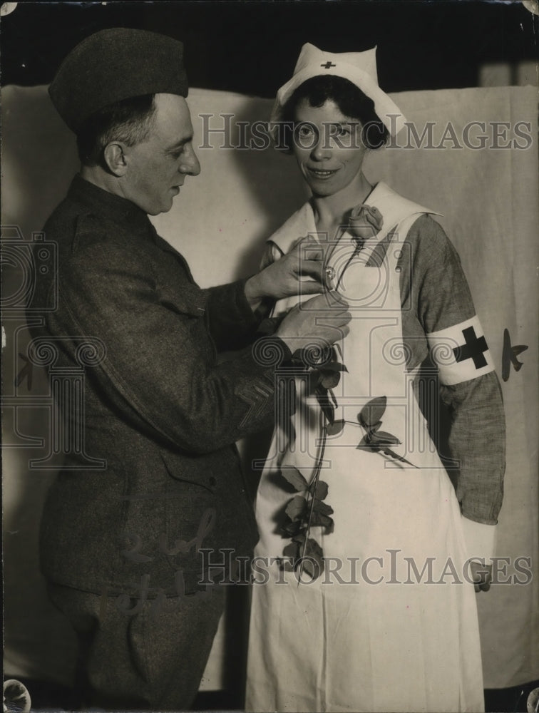 1920 Press Photo Sanford Colham pinned Rose on American Overseas Nurse