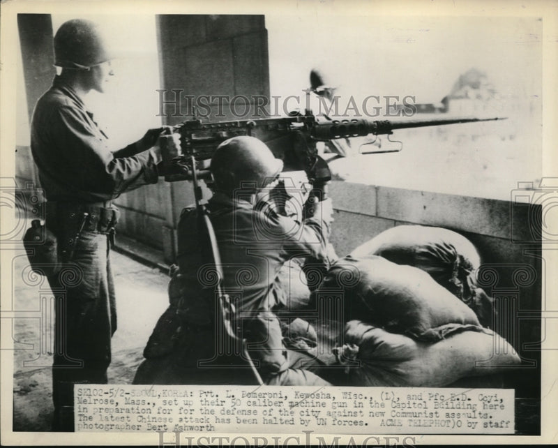 Load image into Gallery viewer, 1951 Press Photo Pvt. L. Pomeroni and Pfc. E.D. Coyi setting up a 50 caliber gun
