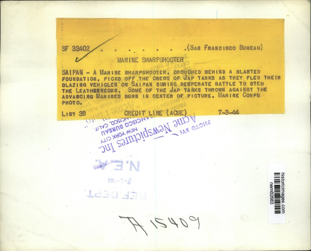 1944 Press Photo Marine sharpshooter watches the Japanese burning vehicle