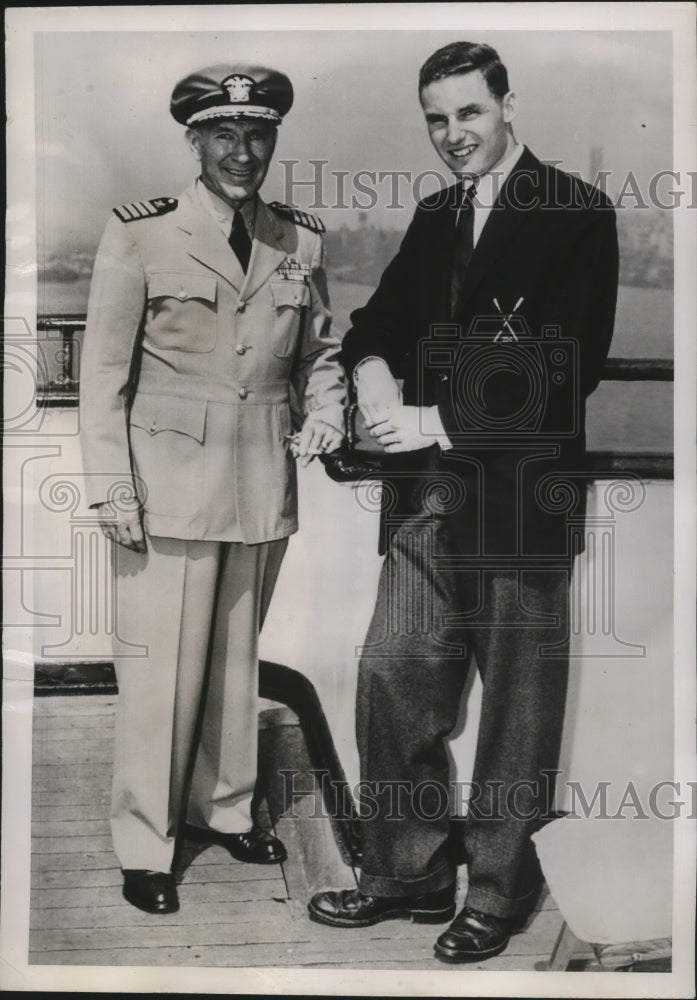 Load image into Gallery viewer, 1951 Press Photo Captain Stanley Joy with his son who is a seaman recruit

