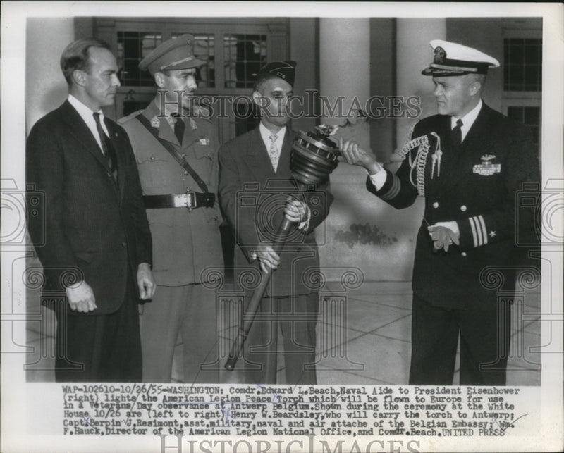Load image into Gallery viewer, 1955 Press Photo Comdr. Edward Beach lighting up the American Legion Peace Torch
