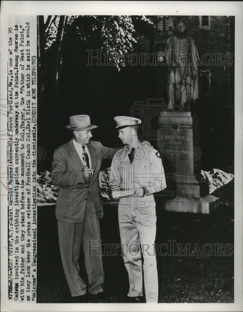 1951 Press Photo Cadet Harold Moores and his father stand before the monument
