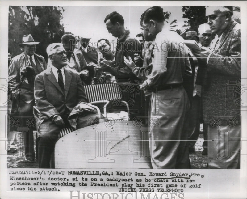 Load image into Gallery viewer, 1956 Press Photo Howard Snyder-President Eisenhower's Doctor chats with newsmen
