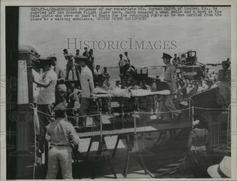Load image into Gallery viewer, 1953 Press Photo Prisoner of War Herman Smith carried from plane in Honolulu
