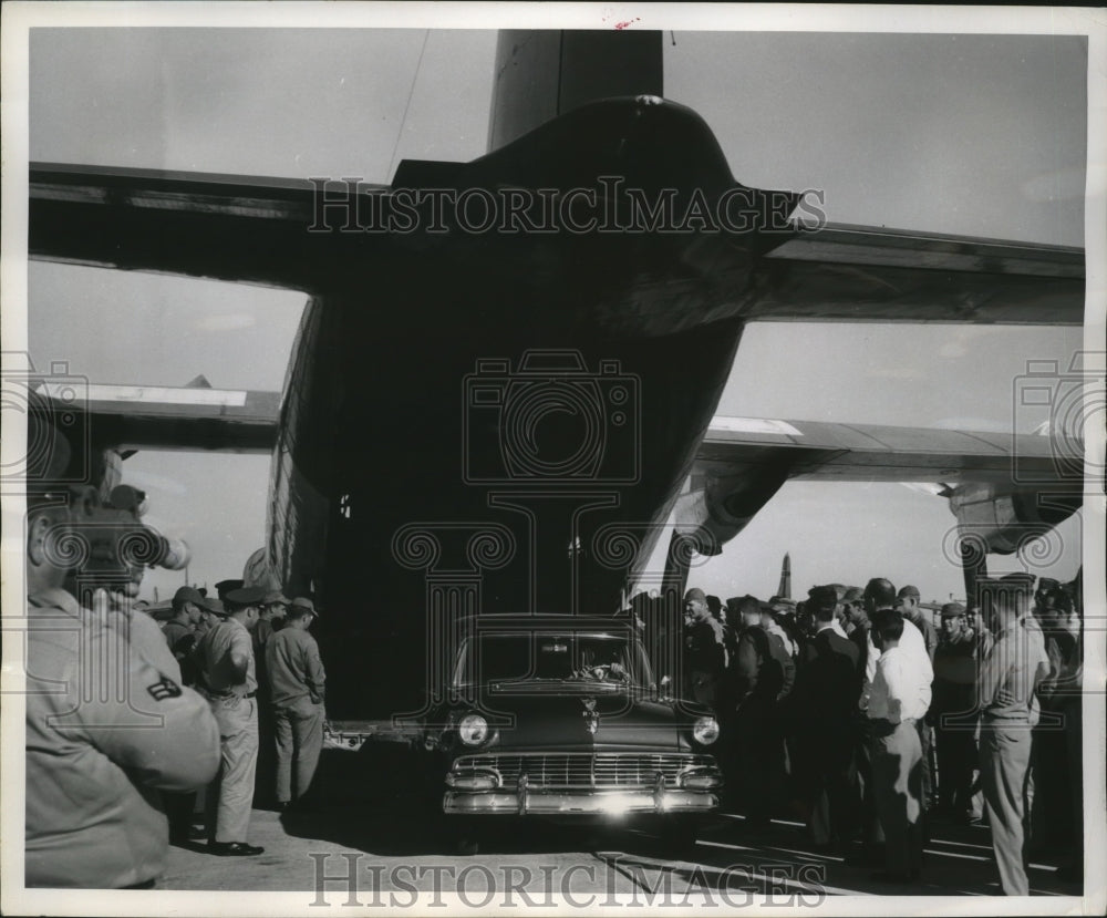 1957 Press Photo A car emerging from cargo cavity of C-130 Lockheed Hercules