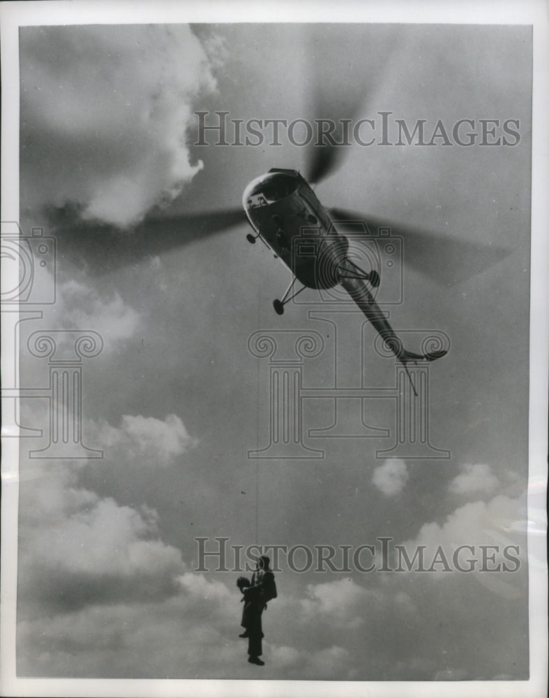 Load image into Gallery viewer, 1952 Press Photo Scene of experimental rescue with a Bristol type Sycamore plane
