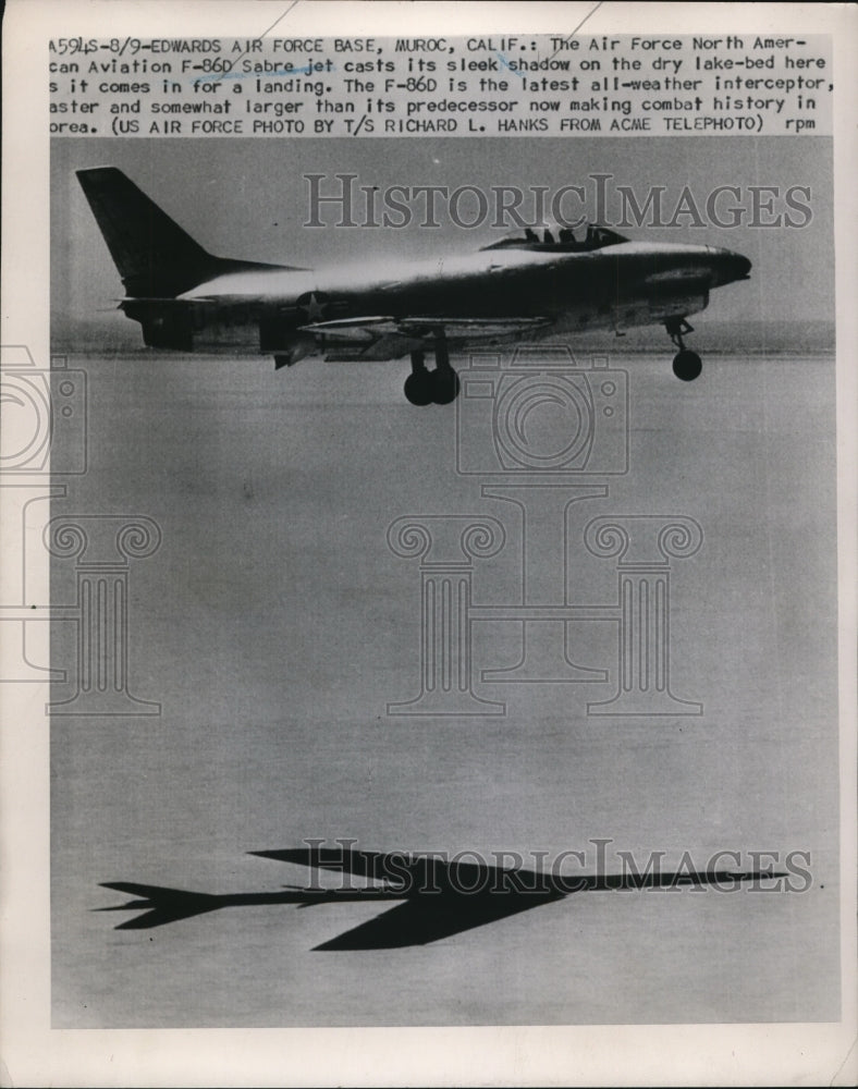 1951 Press Photo F-86D Sabre jets cast shadow as it comes in for a landing