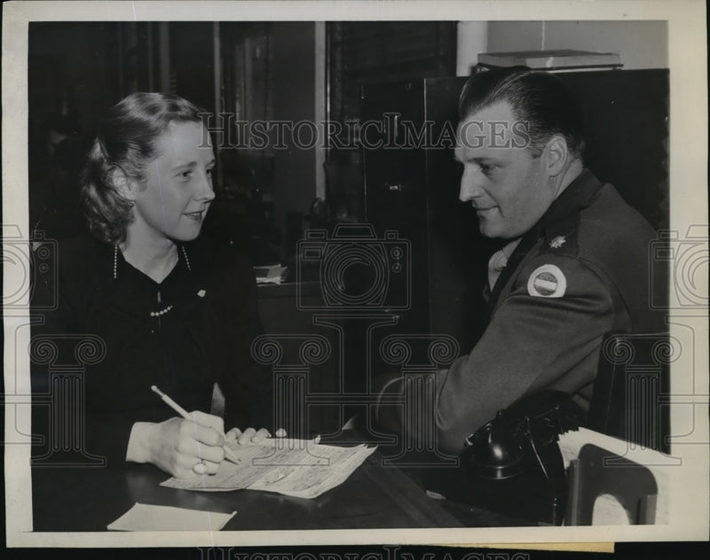 Load image into Gallery viewer, 1945 Press Photo Marion MacDermott, World War II veteran interviews applicant
