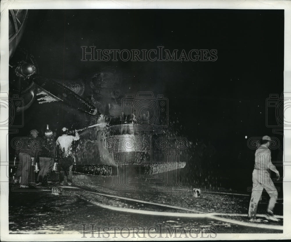 1945 Press Photo Burning Superfort's Engine Dragged to Safe Distance in Guam- Historic Images