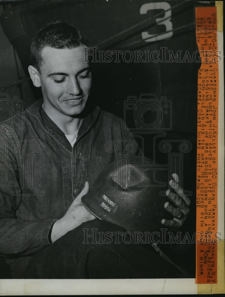 1944 Press Photo John Kelley Prizes His Helmet For Saving His Life From Germans- Historic Images