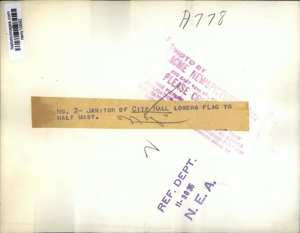 1935 Press Photo New York Janitor of City Hall Lowers Flag to Half Mast NYC