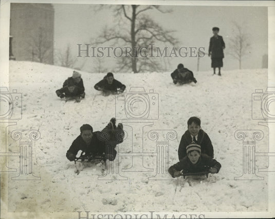 1935 Press Photo New York kids sledding in snow in Central Park in NYC