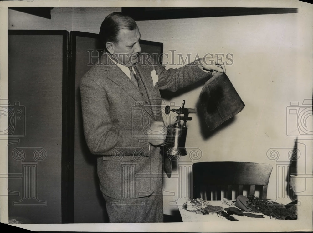 1936 Press Photo New York Fire Commissioner John McElligott Tests Velvet NYCC- Historic Images