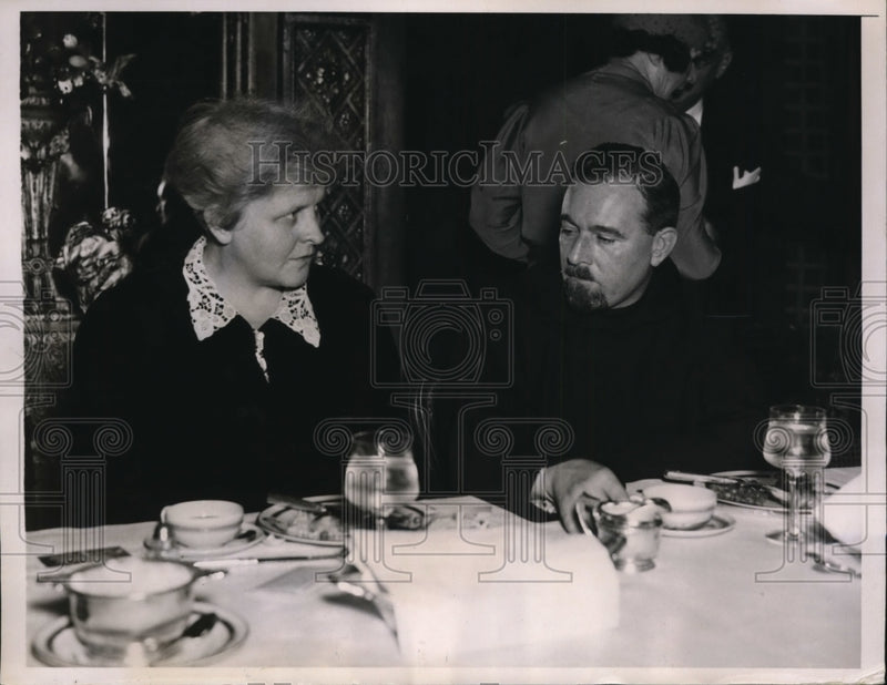 Load image into Gallery viewer, 1937 Press Photo New York Dr Elizabeth Lynsky dines with Father Cypriany NYC
