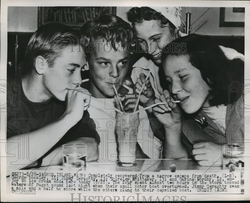 Load image into Gallery viewer, 1951 Press Photo Washon Island WA Children drink soda after rescue WIWA
