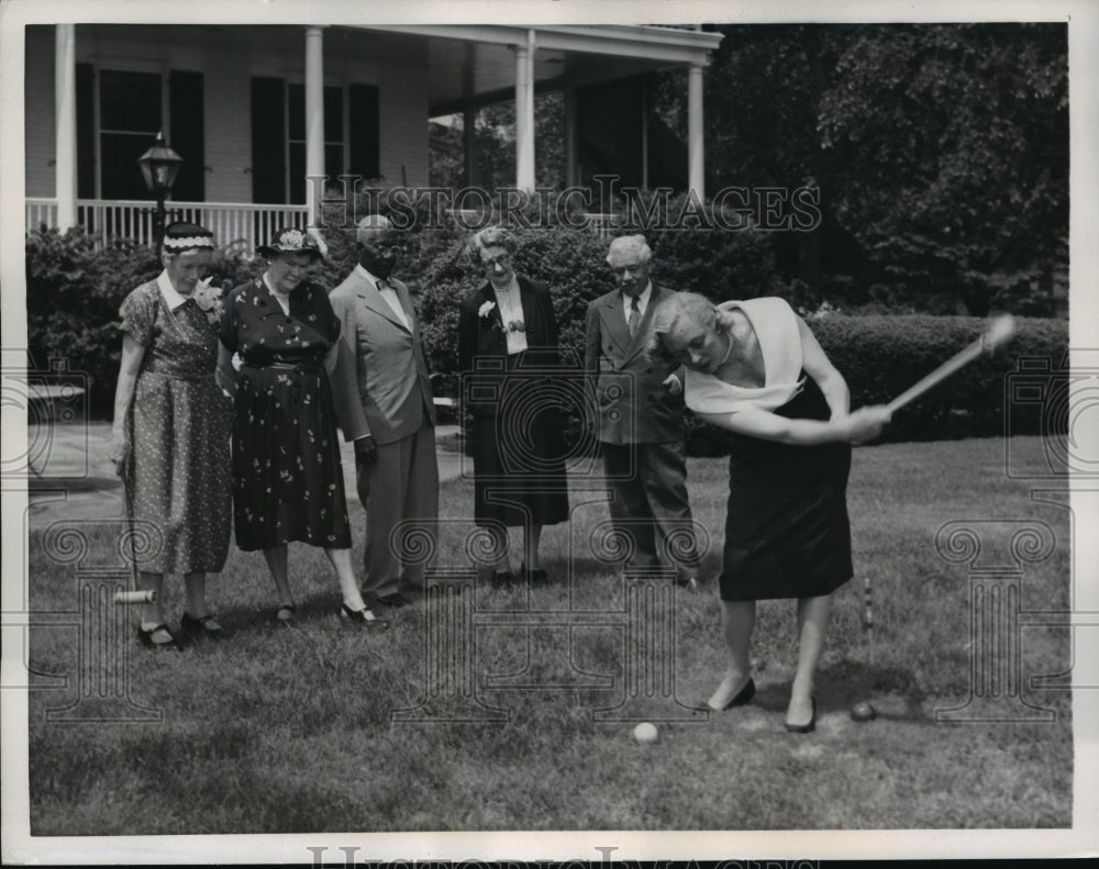 1957 Press Photo Mrs. Robert Wagner shows croquet form at Senior Citizens salute- Historic Images