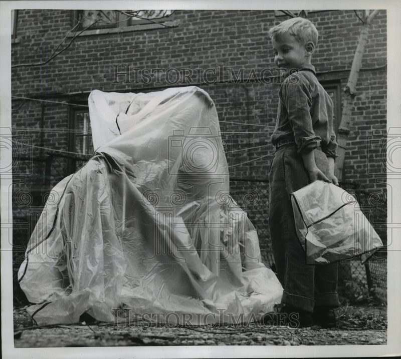 Load image into Gallery viewer, 1957 Press Photo New York Richard Maurel &amp; his bicycle covered in plastic NYC

