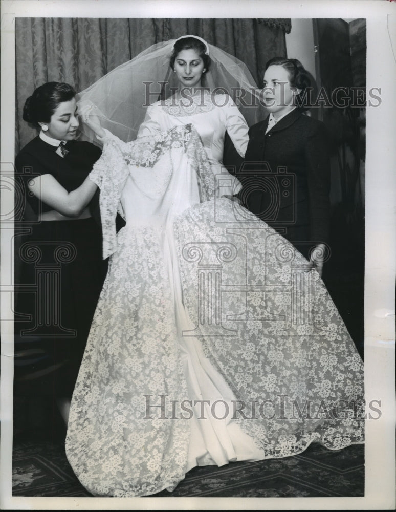 Load image into Gallery viewer, 1957 Press Photo New York Frances Grigoriadis models wedding dress NYC
