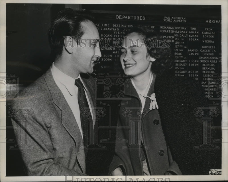 Load image into Gallery viewer, 1947 Press Photo New York Bartholomew Stern Greets Bride at LaGuardia Field NYC

