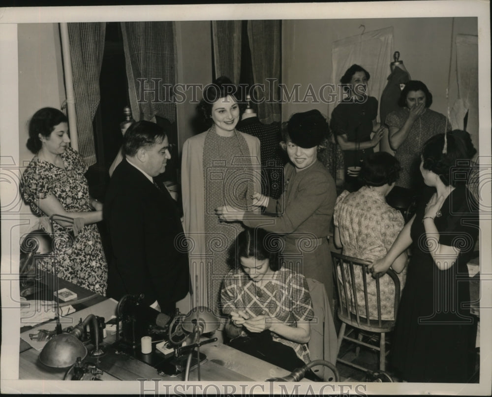 1940 Press Photo New York Mayor FH LaGuardia looks over garments NYC - neny24940