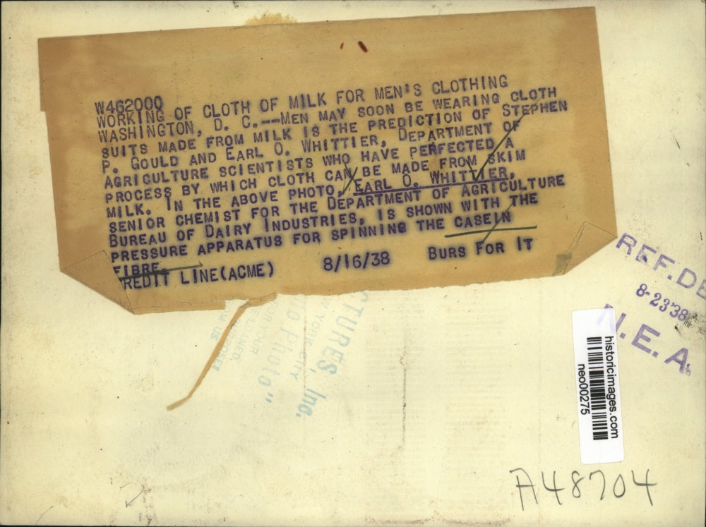 1938 Press Photo chemist Earl Whittier working on a cloth made from milk