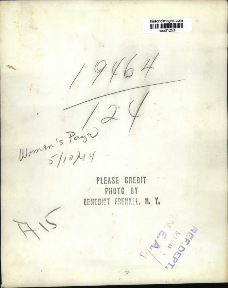 1944 Press Photo A fashion model in striped blouse & dark skirt & jacket