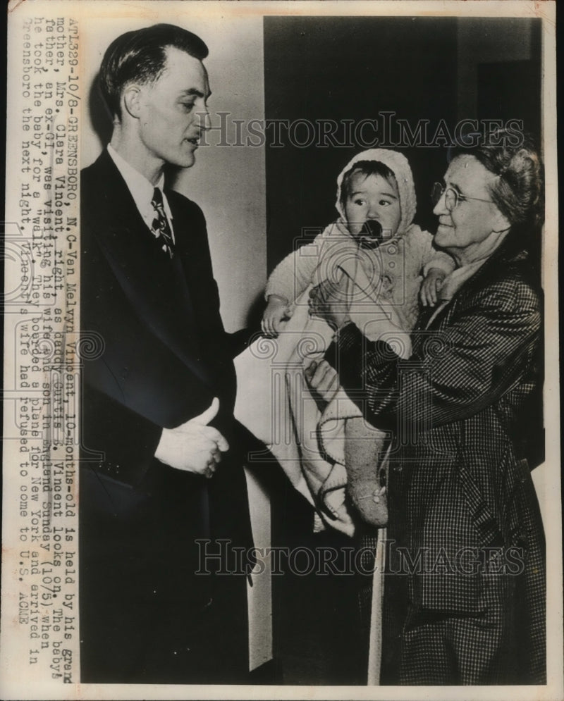 Load image into Gallery viewer, 1947 Press Photo Van Melvyn Vincent held by Clara Vincent, Father Curtis Vincent
