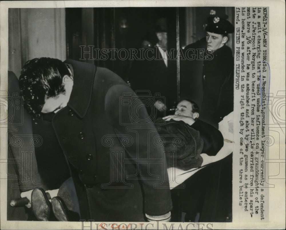 1952 Press Photo Sol A. Rosenblatt carried from apartment after being shot
