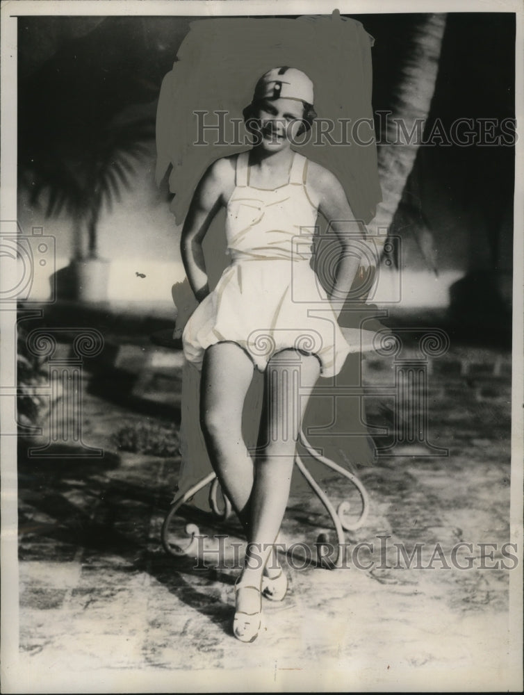 Load image into Gallery viewer, 1934 Press Photo Delores Towner in bell boy cap &amp; romper sun suit at Miami Beach
