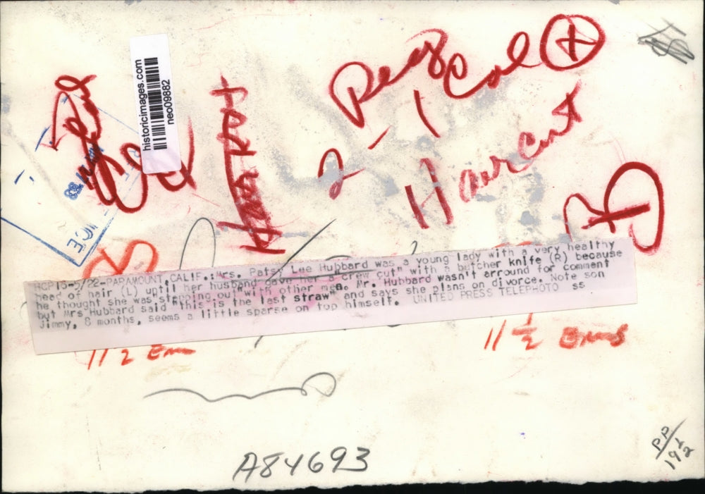 1953 Press Photo Mrs. Patsy Lee Hubbard given crew cut by her husband with son