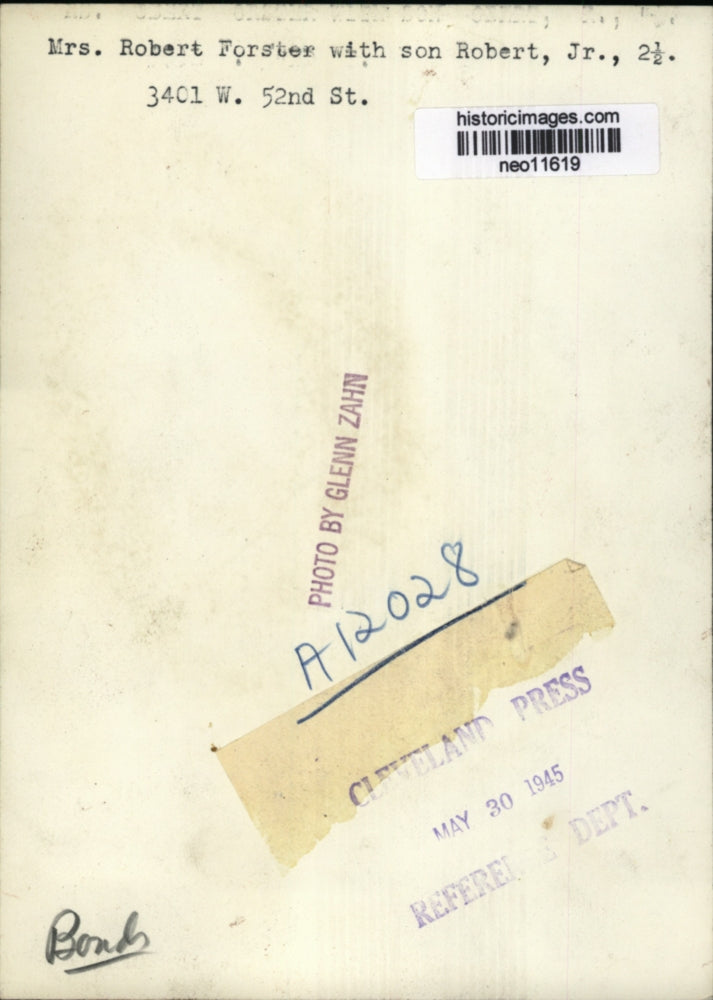 1945 Press Photo Mrs. Robert Foster Showing Bonds to Her Son Robert,Jr