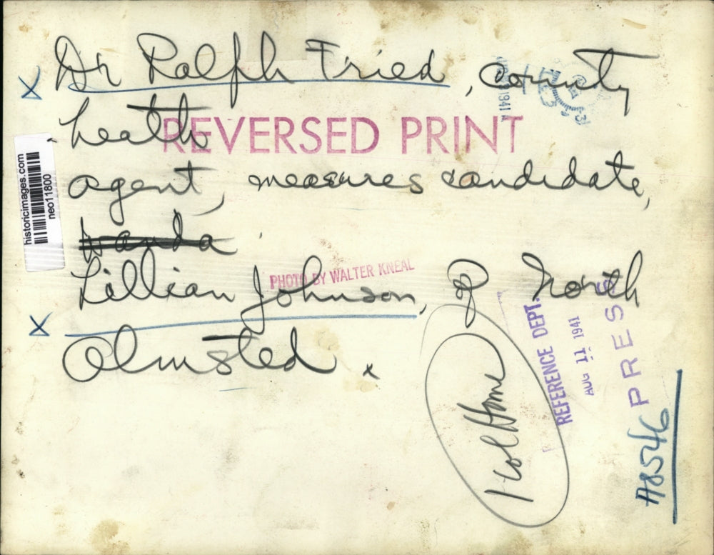 1941 Press Photo Dr. Ralph Fried measures Lillian Johnson of Olmsted