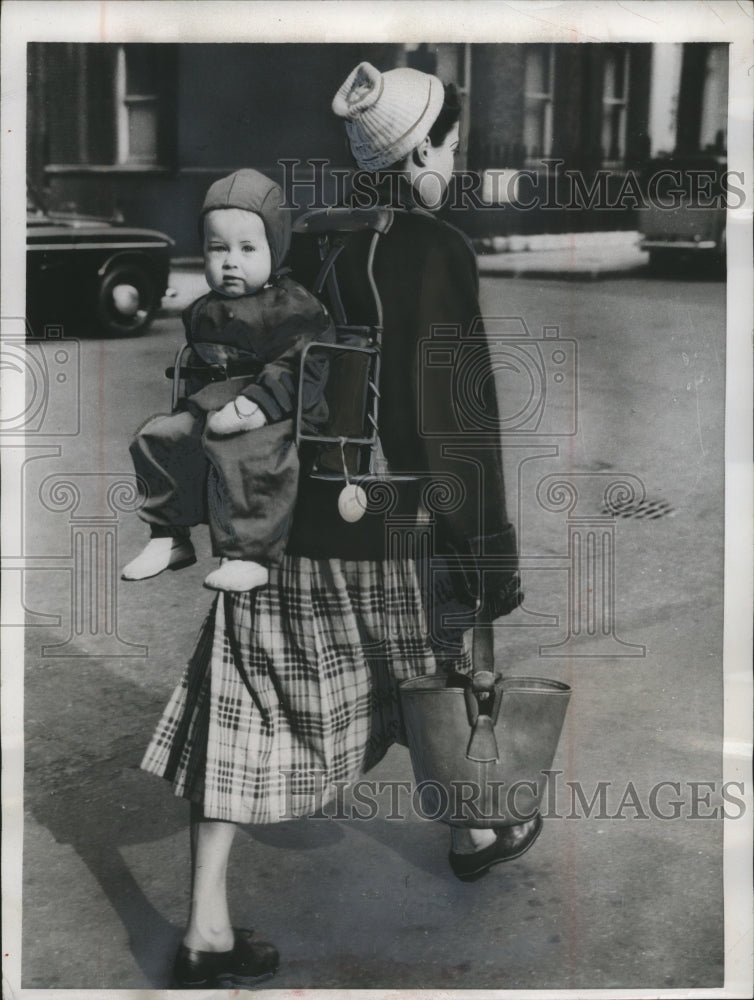 1955 Press Photo Woman with Back Baby Carrier, London - neo11913