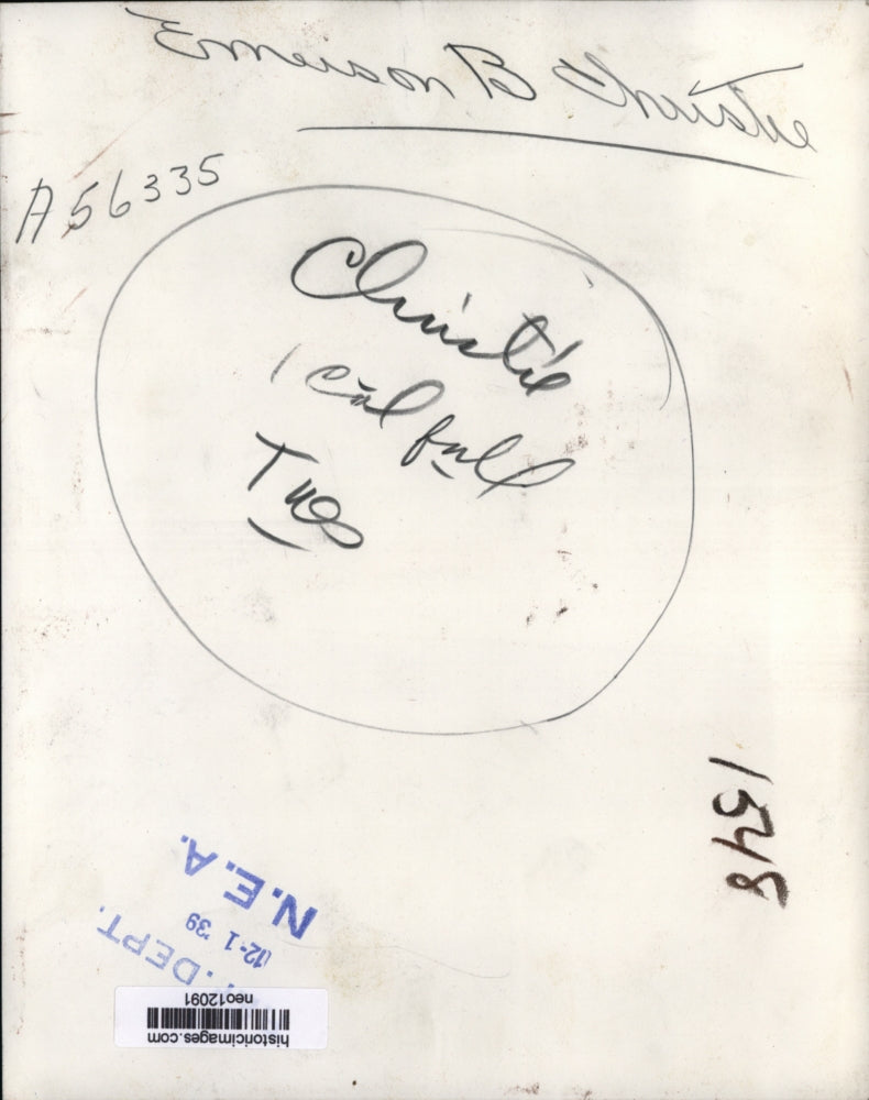 1939 Press Photo Emerson B. Christie Looking Over Papers with Magnifying Glass