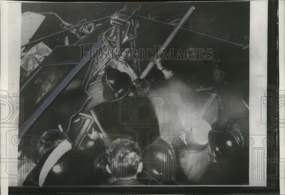 1957 Press Photo Firemen free man from London commuter train wreck - neo13627