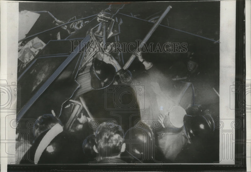 Load image into Gallery viewer, 1957 Press Photo Firemen free man from London commuter train wreck - neo13627

