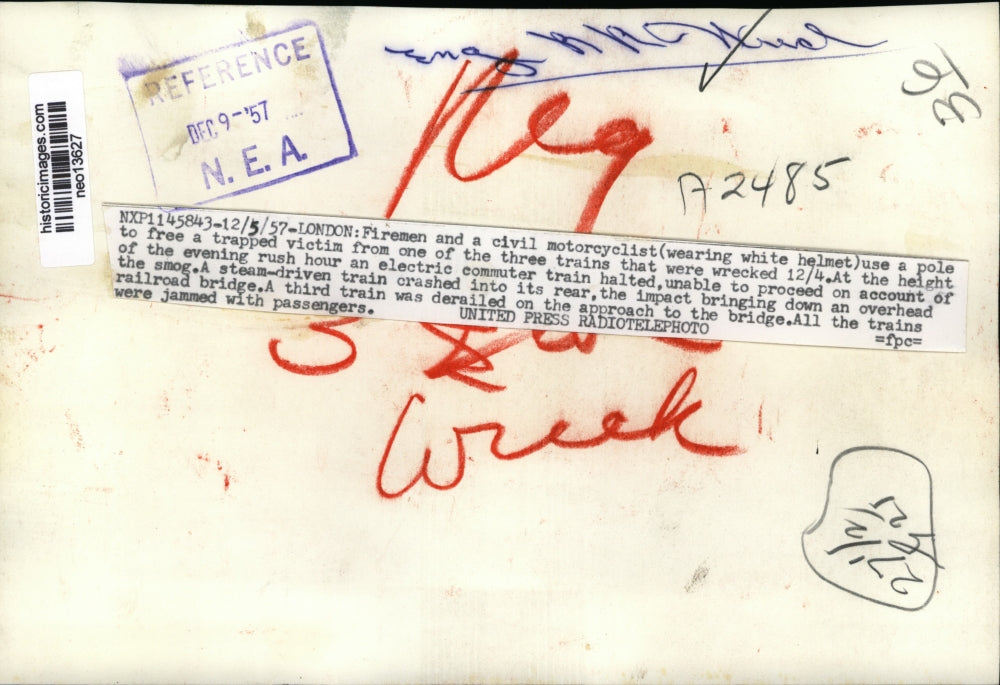 1957 Press Photo Firemen free man from London commuter train wreck - neo13627