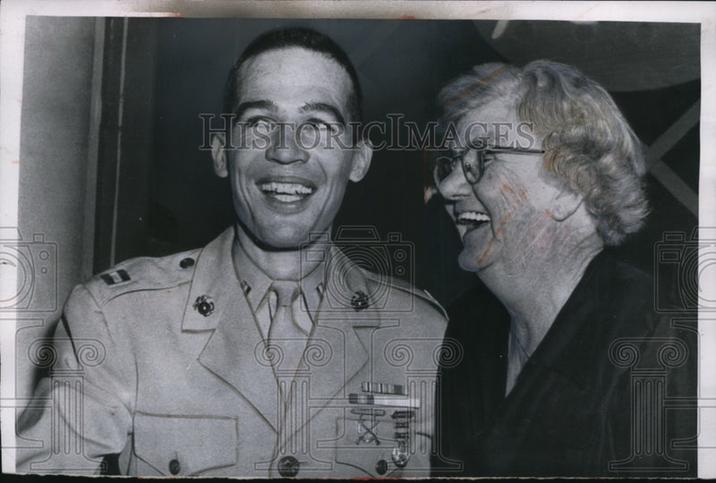 Load image into Gallery viewer, 1955 Press Photo Myrtle Power &amp; Marine Capt. Richard McCutcheon after game show
