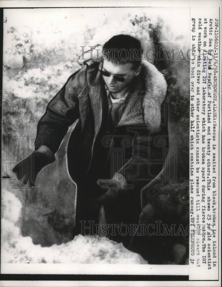 1958 Press Photo Reid Neufer scientist at Anchorage Alaska with IGY lab