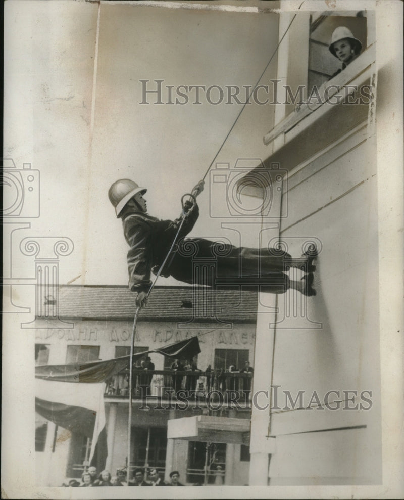 Load image into Gallery viewer, 1939 Press Photo Lady Firefighter of Yugoslavia Trains for National Emergencies
