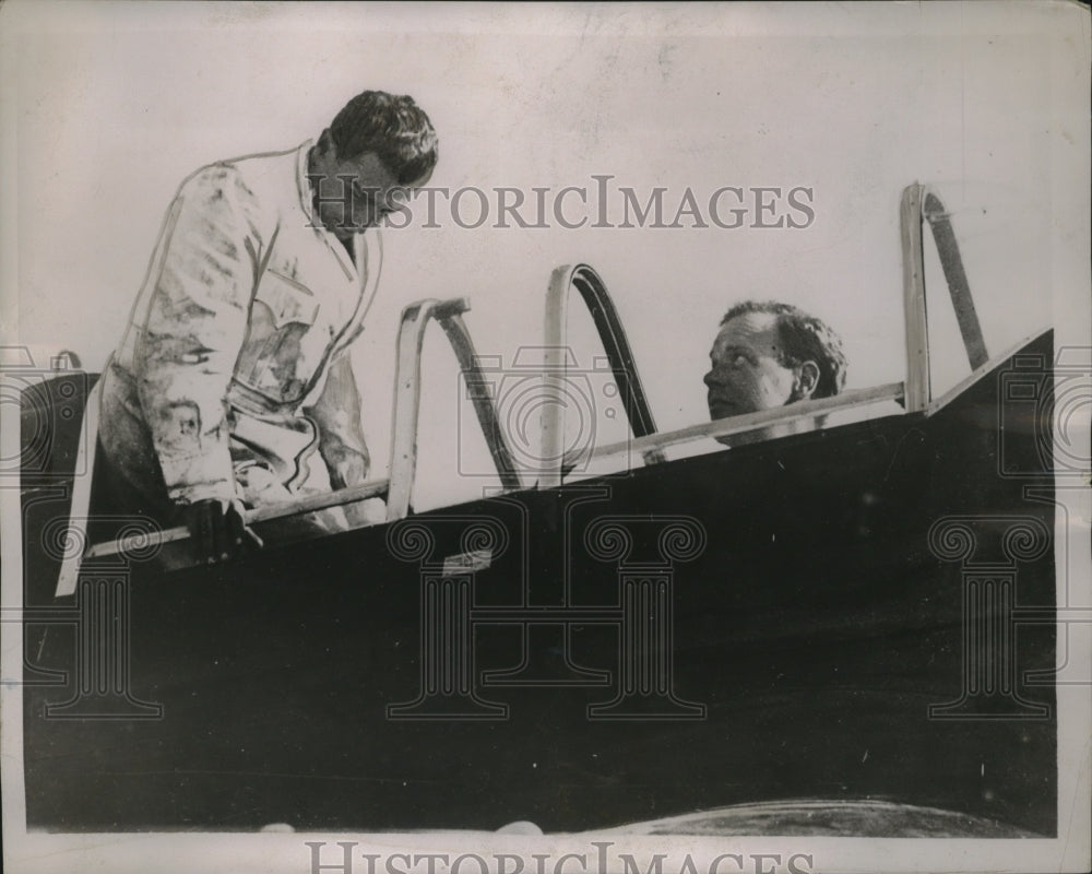 1937 Press Photo Col. Lindbergh Gives Mechanic Examination Prior to India Flight- Historic Images