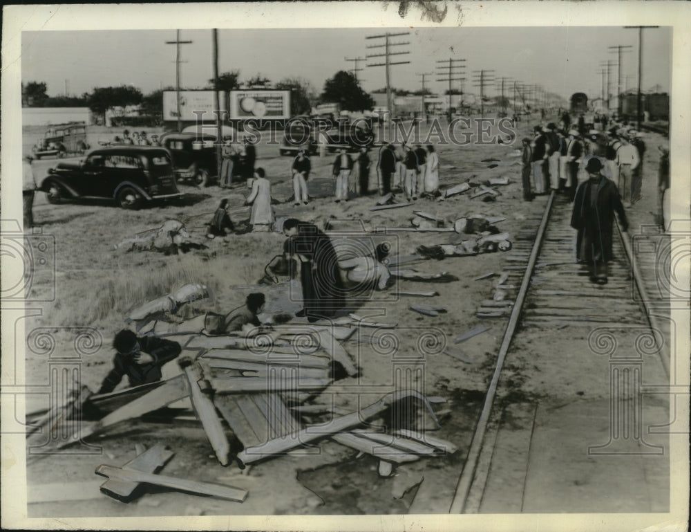1940 Press Photo Priest Administers Last Rites to Dying Person Amid Train Wreck