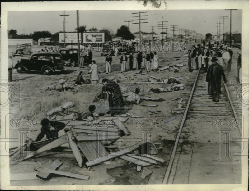 Load image into Gallery viewer, 1940 Press Photo Priest Administers Last Rites to Dying Person Amid Train Wreck
