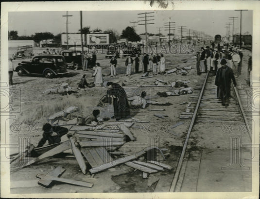 1940 Press Photo Priest Administers Last Rites to Dying Person Amid Train Wreck