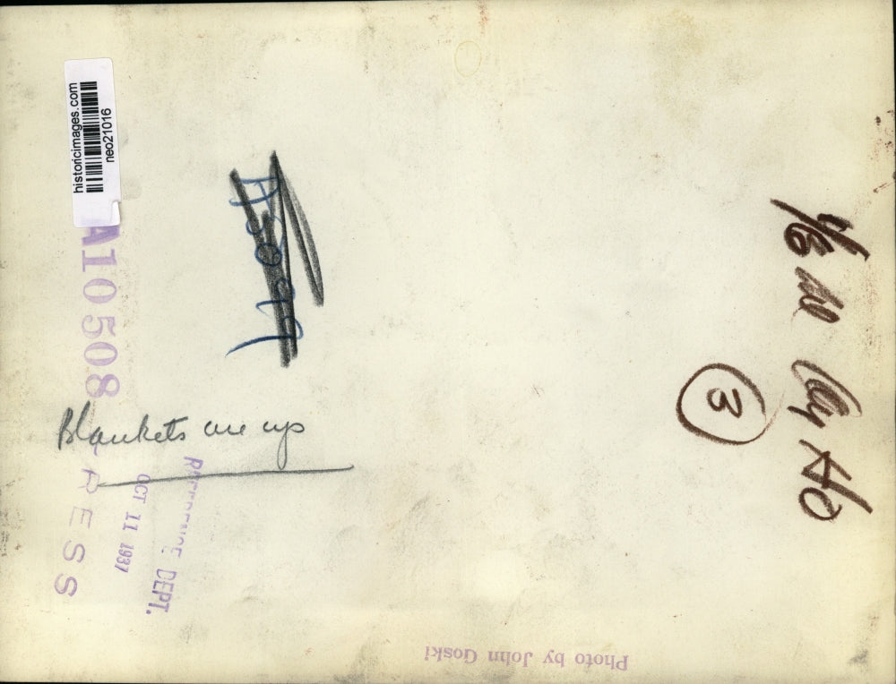 1937 Press Photo Woman Handling Blankets - neo21016